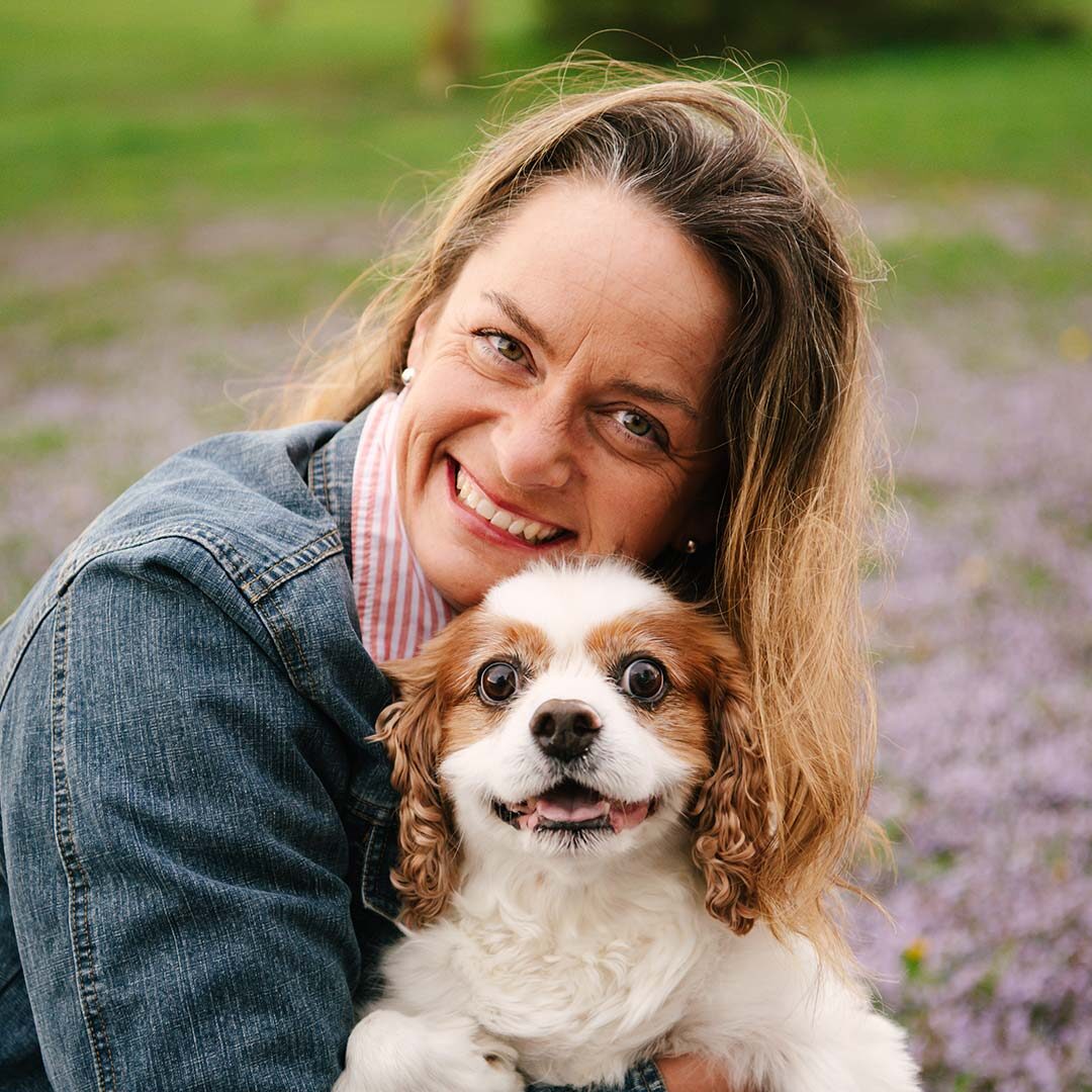 veterinarian posing for a photo with her dog
